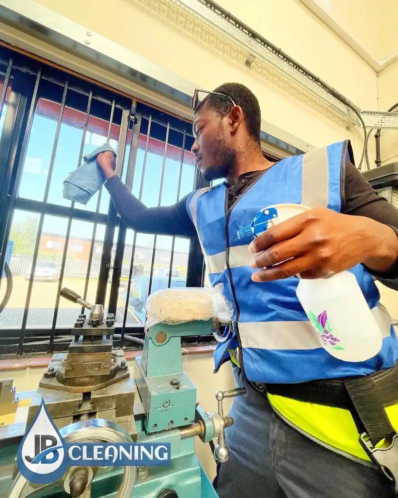 JB Cleaning operative in hi-vis cleaning commercial glazing